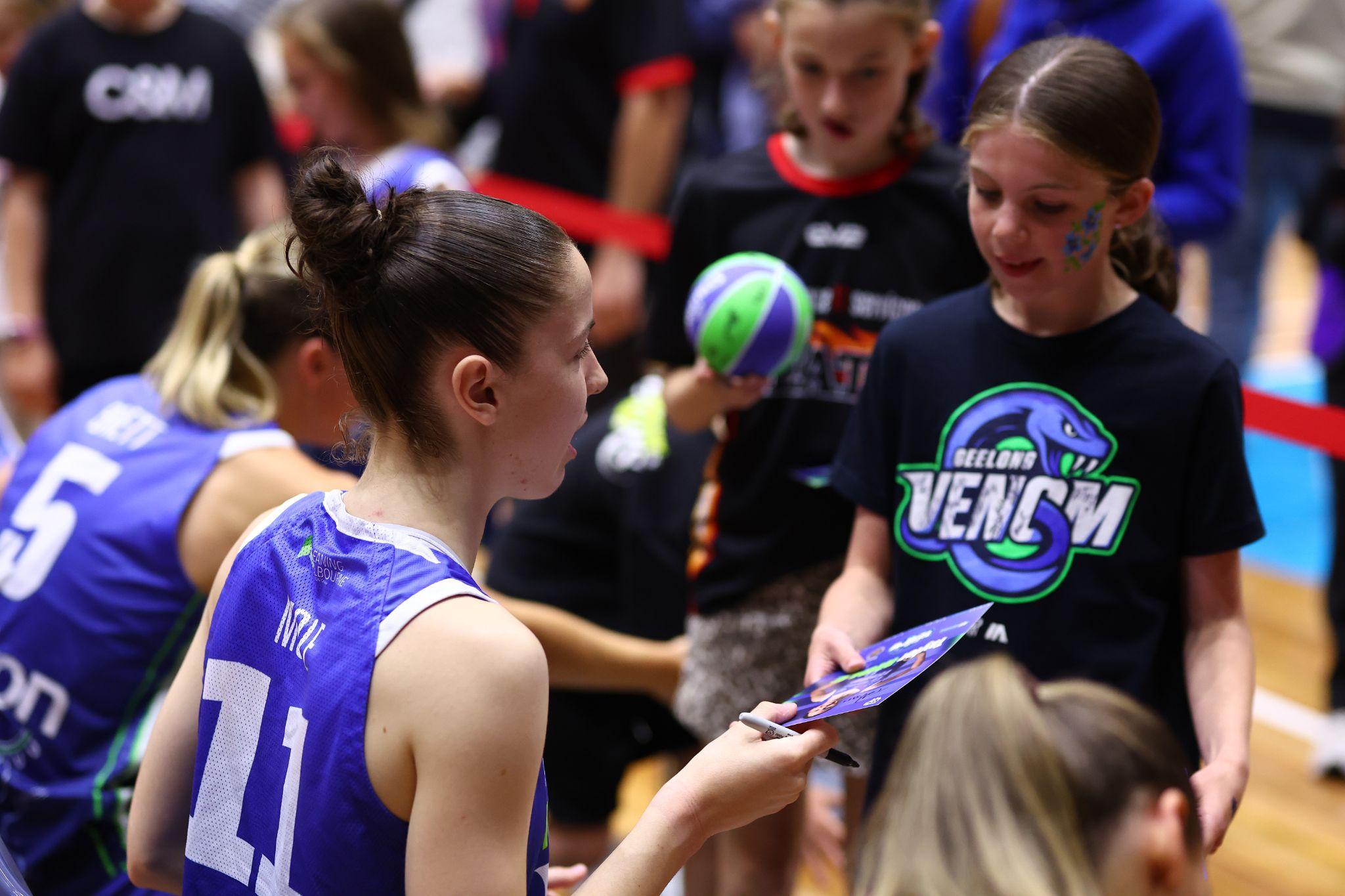 Junior basketball participants in Geelong Venom shirts on court at a community session