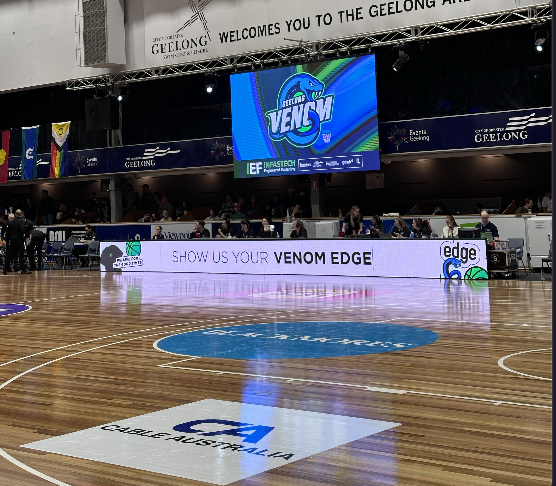 Courtside LED signage and on-court branding at a Geelong home game
